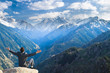 © petunyia - businessman at the top of the mountain is pleased