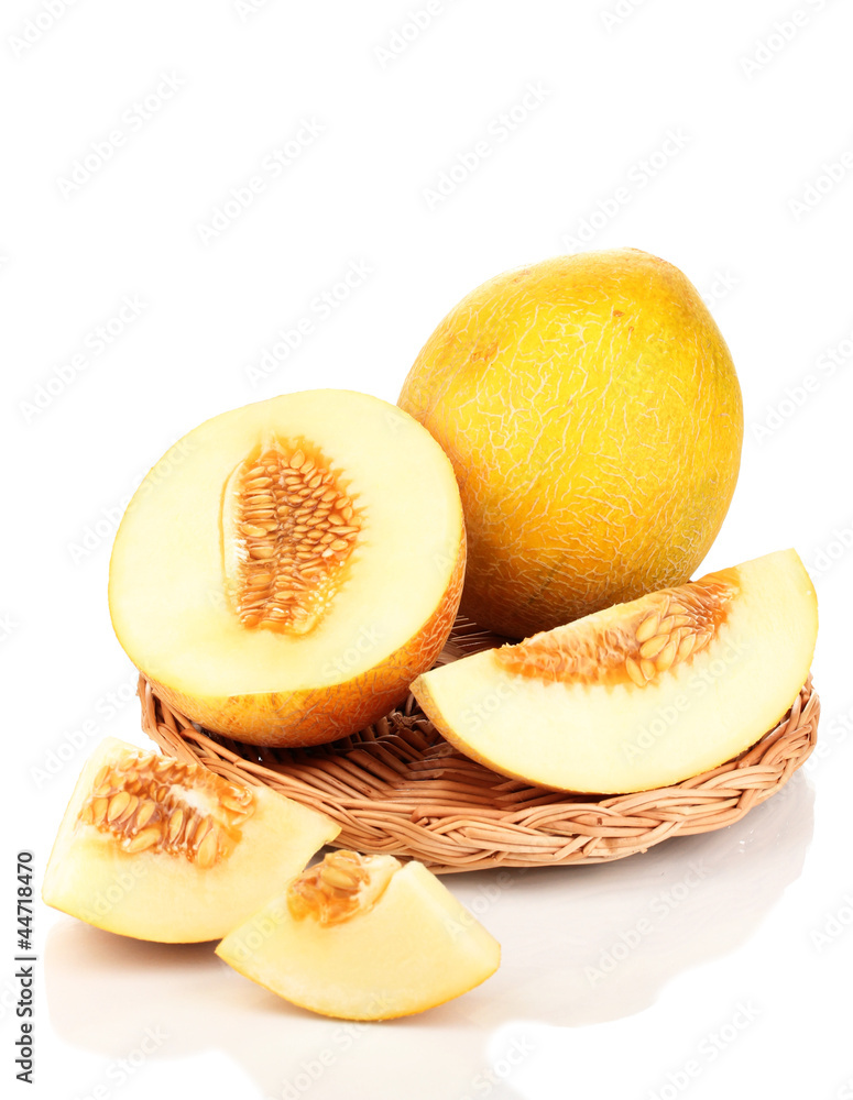 Ripe melons on wicker cradle isolated on white