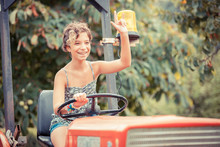 Little Girl On The Tractor