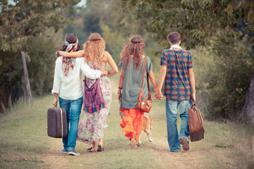 Wall Mural - Hippie Group Walking on a Countryside Road