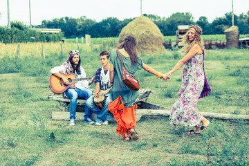 Wall Mural - Hippie Group Playing Music and Dancing Outside