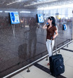 Woman calling on the phone at the airport