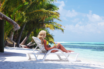 Wall Mural - tropical woman on lounge