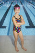 © Brocreative - Confident Young Swimmer standing by Swimming Pool