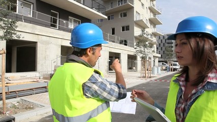 Wall Mural - Engineers checking buildings under construction