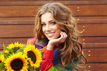 Wall Mural - Autumn fashion woman with flowers