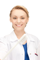 Poster - attractive female doctor with toothbrush