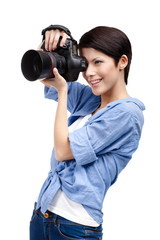 Wall Mural - Woman takes images holding photographic camera