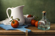 © maglara - Still life with tomatoes and white jug