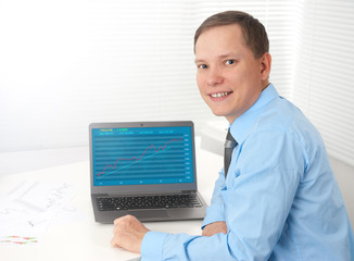 Wall Mural - Business man checking stock diagram in office