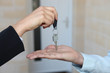 Estate-agent handing over house keys