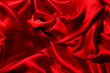 Red silk background. A lot of crumpled folds