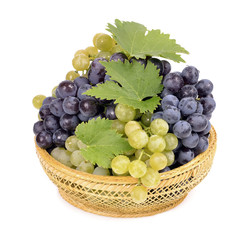 Wall Mural - Black and white grapes in a bowl isolated white background,drops