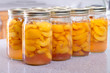 Row of canned peaches