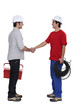 © auremar - duo of electrician shaking hands