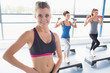 © WavebreakmediaMicro - Smiling blonde at aerobics class