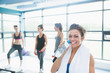 © WavebreakmediaMicro - Woman with bottle of water in aerobics class