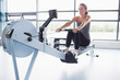 © WavebreakmediaMicro - Woman training on row machine