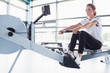 © WavebreakmediaMicro - Concentrating  woman training on row machine