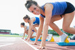 © WavebreakmediaMicro - Happy woman at starting blocks