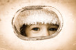 © Sunny studio - Child looking through hole
