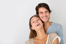 Cheerful Young Couple Standing On White Background, Isolated