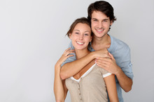 Cheerful Young Couple Standing On White Background, Isolated