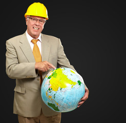 Male Architect Pointing At World Globe