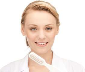 Poster - attractive female doctor with toothbrush