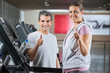 © Tyler Olson - Instructor And Client Showing Thumbs Up Sign In Health Club