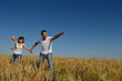 © .shock - happy couple in wheat field
