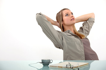 Wall Mural - woman relaxing at her desk