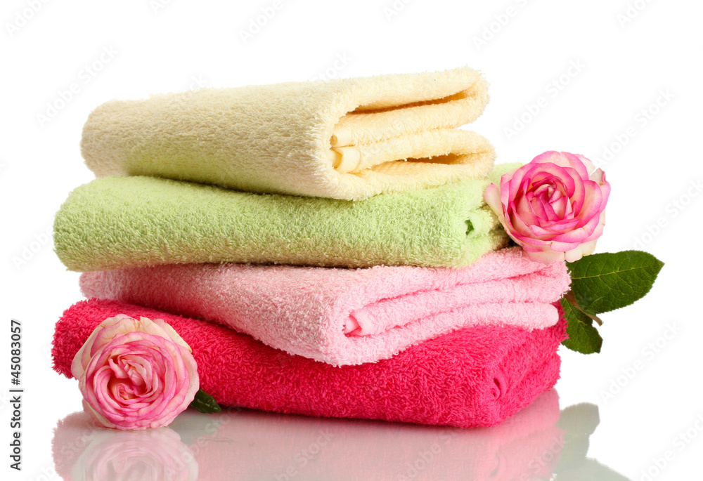 bright towels and flower isolated on white