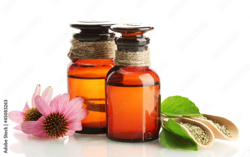 medicine bottles with purple echinacea , isolated on white
