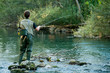 © Samo Trebizan - A fisherman fishing on a river