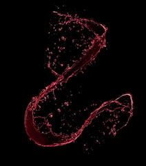 Red wine splash, isolated on black background