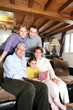 © auremar - Family gathered round a laptop