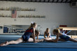 © Rubberball - Girls stretching in gym