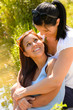 © CandyBox Images - Mother holding her teen daughter in arms