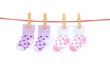 © Freer - two pairs baby socks hanging with clipping path