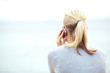 © Flamingo Images - Rear view of woman chatting on a mobile