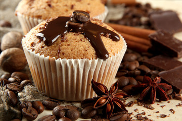 Canvas Print - tasty muffin cakes with chocolate, spices and coffee seeds,