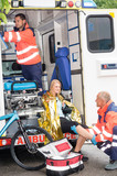 Fototapeta  - Paramedics with woman bike accident in ambulance