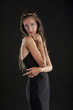 © aviavlad - A young woman in a black dress