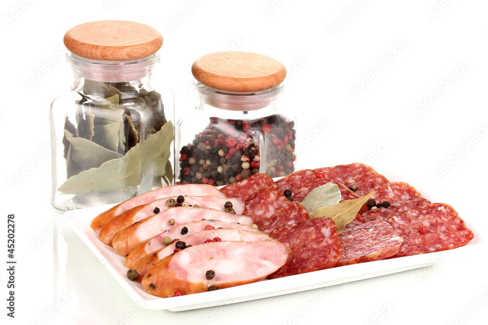 Tasty sliced sausage on plate isolated on white