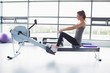 © WavebreakmediaMicro - Woman working out on row machine