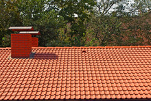 The Roof Is Covered With Red Tiles