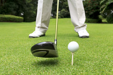 Close Up Shot Of Golfer Ready To Tee Off