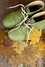 Green Leather Boots And Yellow Leaves