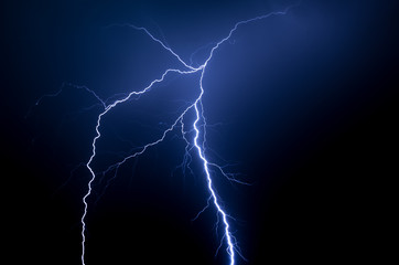 spetacular blue lightning strike in the night